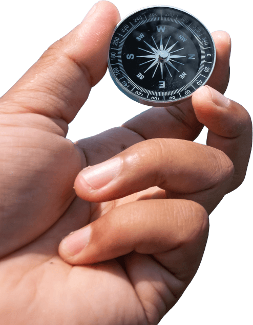 Hand hält Kompass